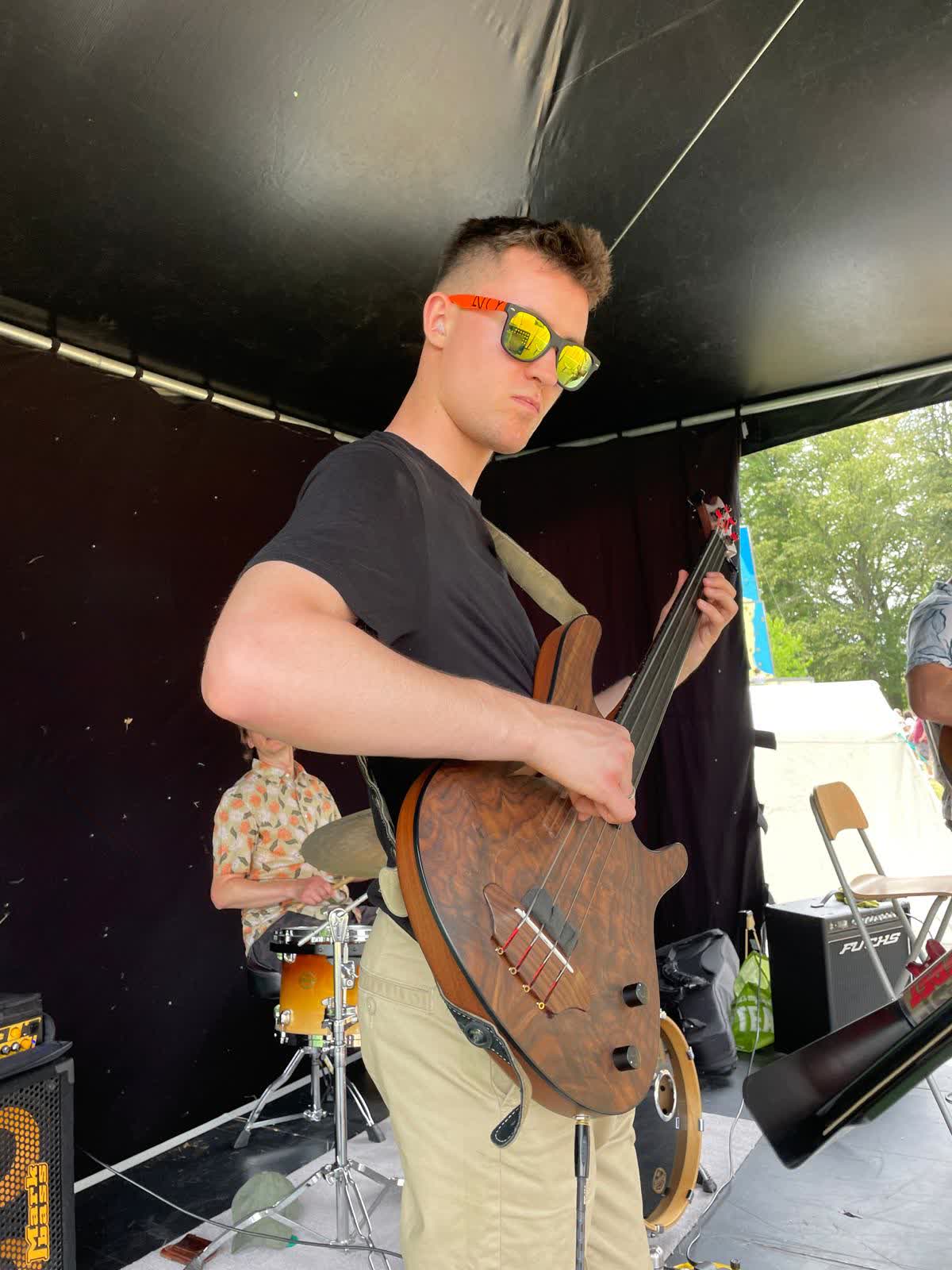 Adam on bass guitar, Highland Gathering '23
